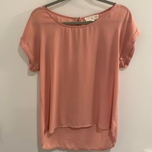 Pink short sleeve dress shirt.